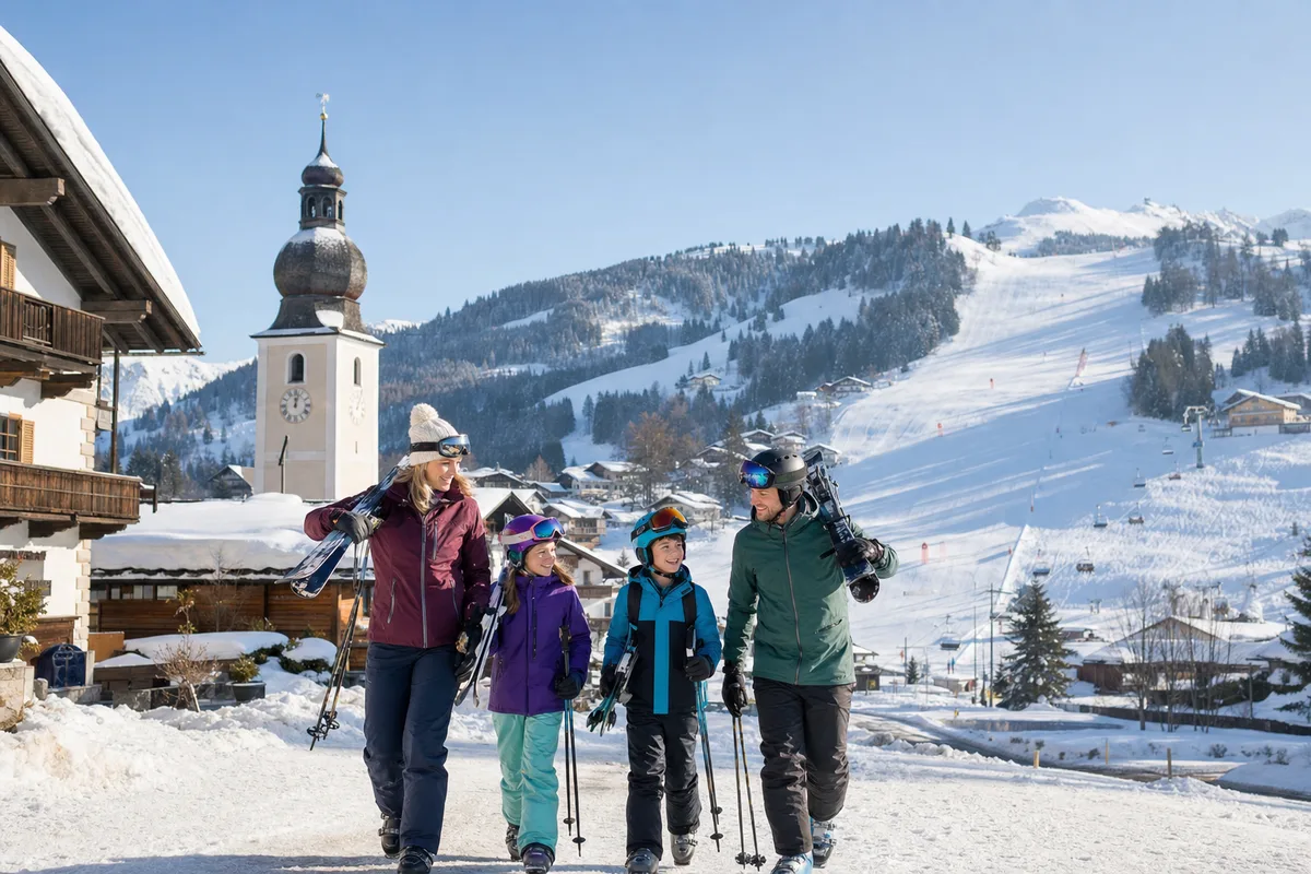 Family heading for the slopes in an Austrian alpine village